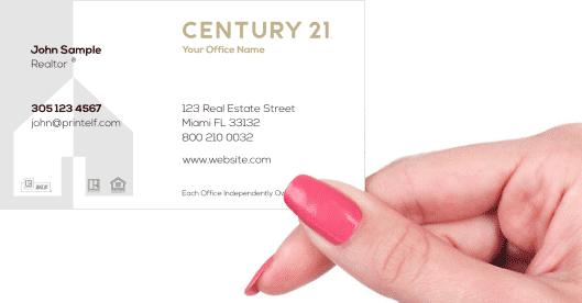 Hand holding business card - Century 21 Residential Commercial business card