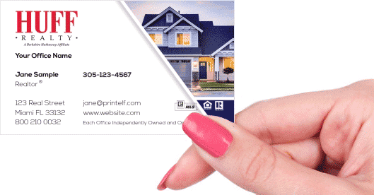 Hand holding business card - HUFF Realty residential business card