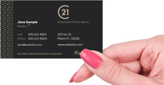 Hand holding business card - Century 21 Commercial business card