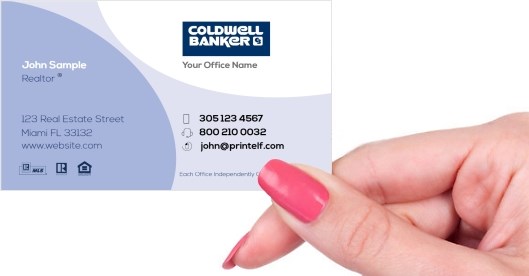 Hand holding business card -  Coldwell banker agent business card