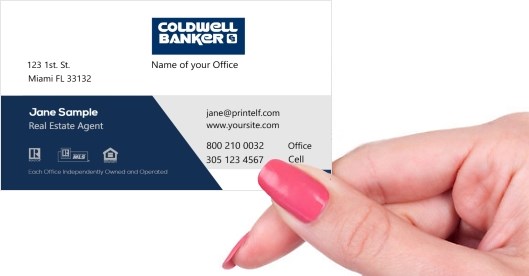 Hand holding business card -  coldwell banker realtor business card