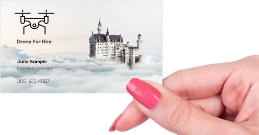 Hand holding business card -  Drone For Hire business card