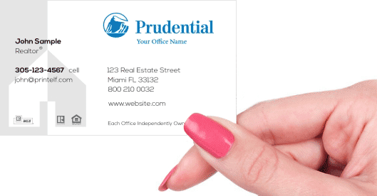 Hand holding business card - Prudential Commercial business card